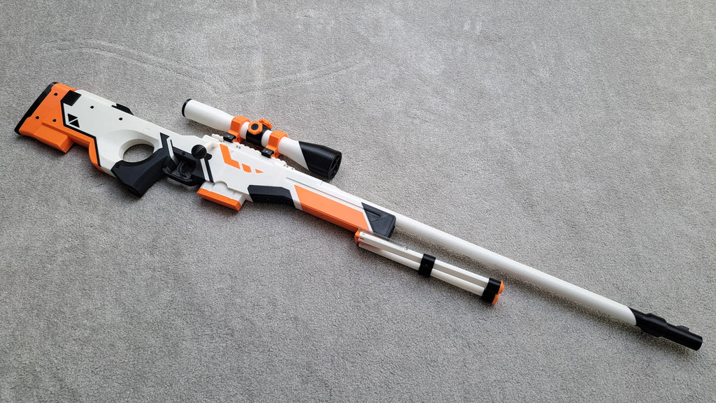 Pusca AWP Asiimov, Counter Strike 2, marime reala, 120 cm, mecanism lansare elastice, distanta pana la 15m, jucarie interactiva & pentru colectionari